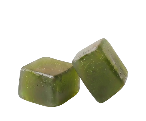Three green sea moss gummies stacked on a light green background